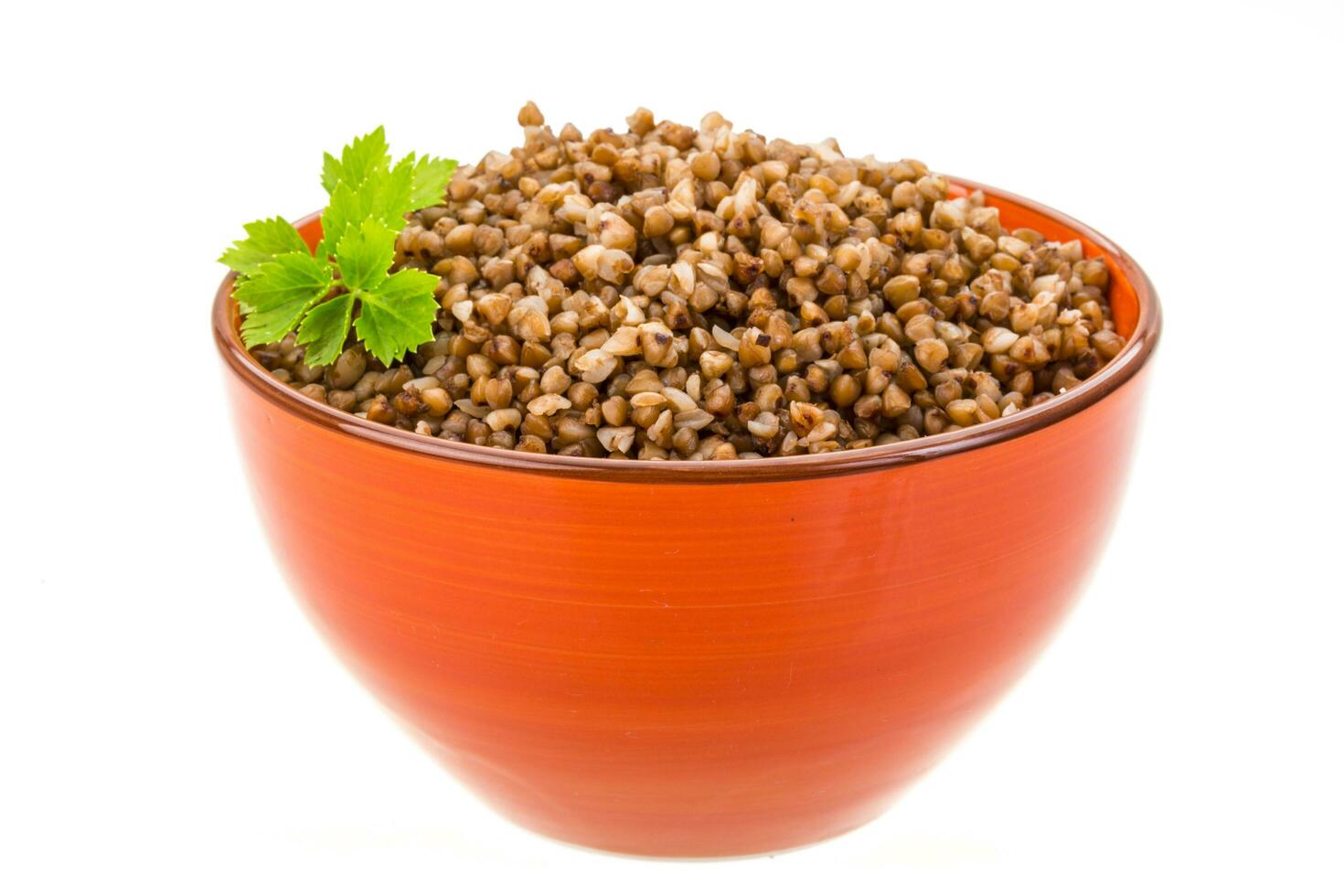 Buckwheat in a bowl on white background photo