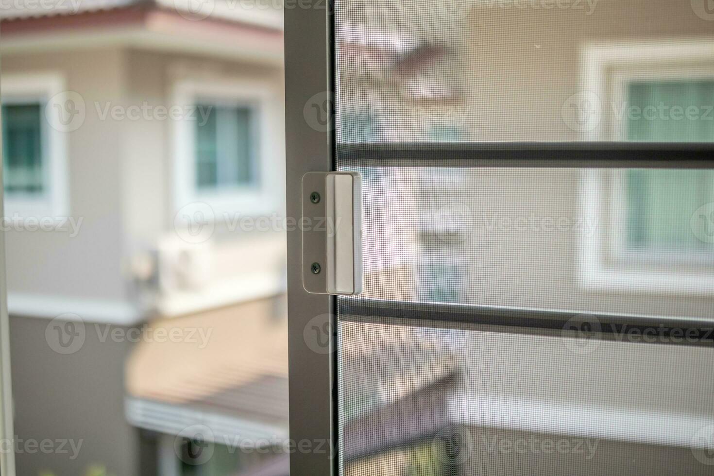 mosquito net wire screen on house window protection against insect photo