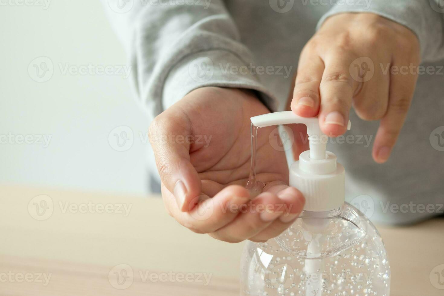 Woman using alcohol sanitizer gel rub for cleaning hand COVID-19 corona virus prevention concept photo