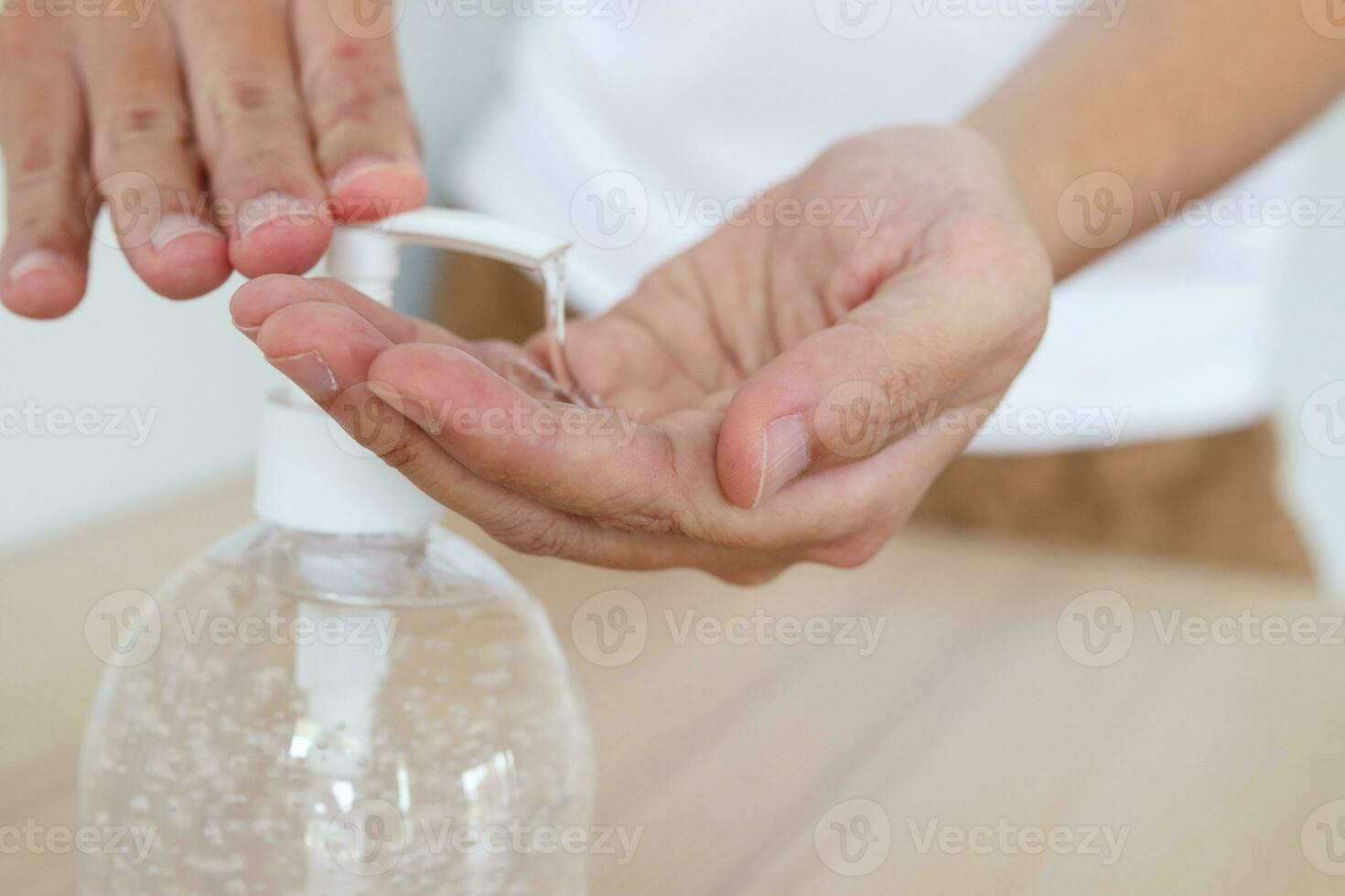 Woman using alcohol sanitizer gel rub for cleaning hand COVID-19 corona virus prevention concept photo