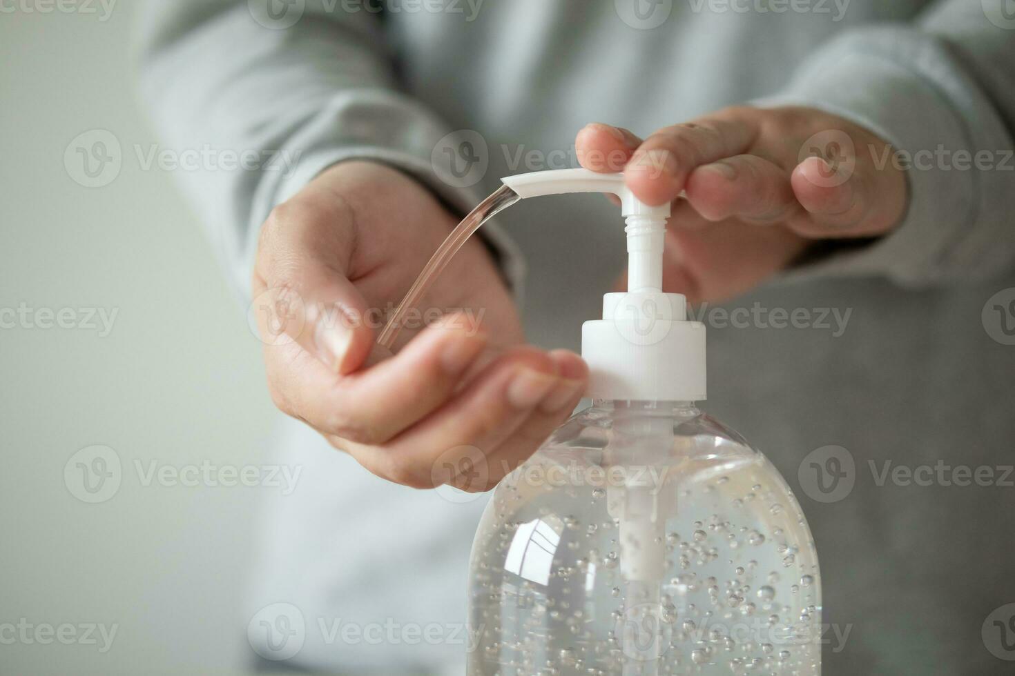 Woman using alcohol sanitizer gel rub for cleaning hand COVID-19 corona virus prevention concept photo