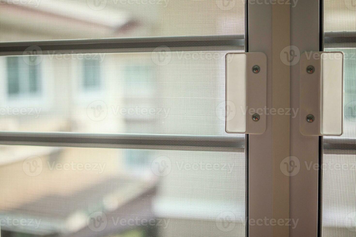 mosquito net wire screen on house window protection against insect photo