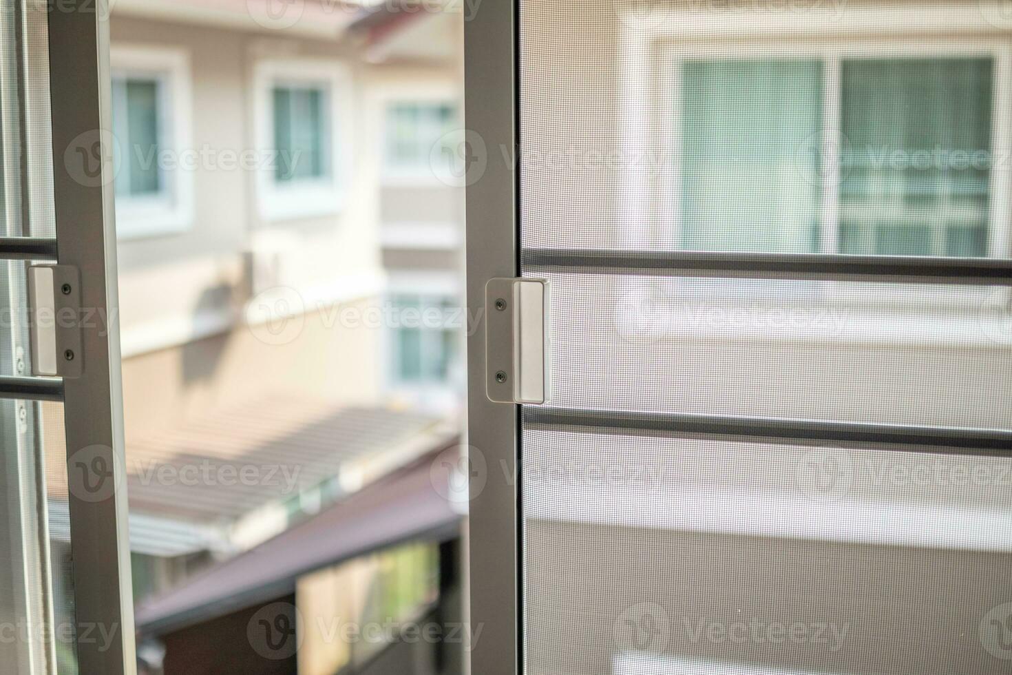 mosquito net wire screen on house window protection against insect photo