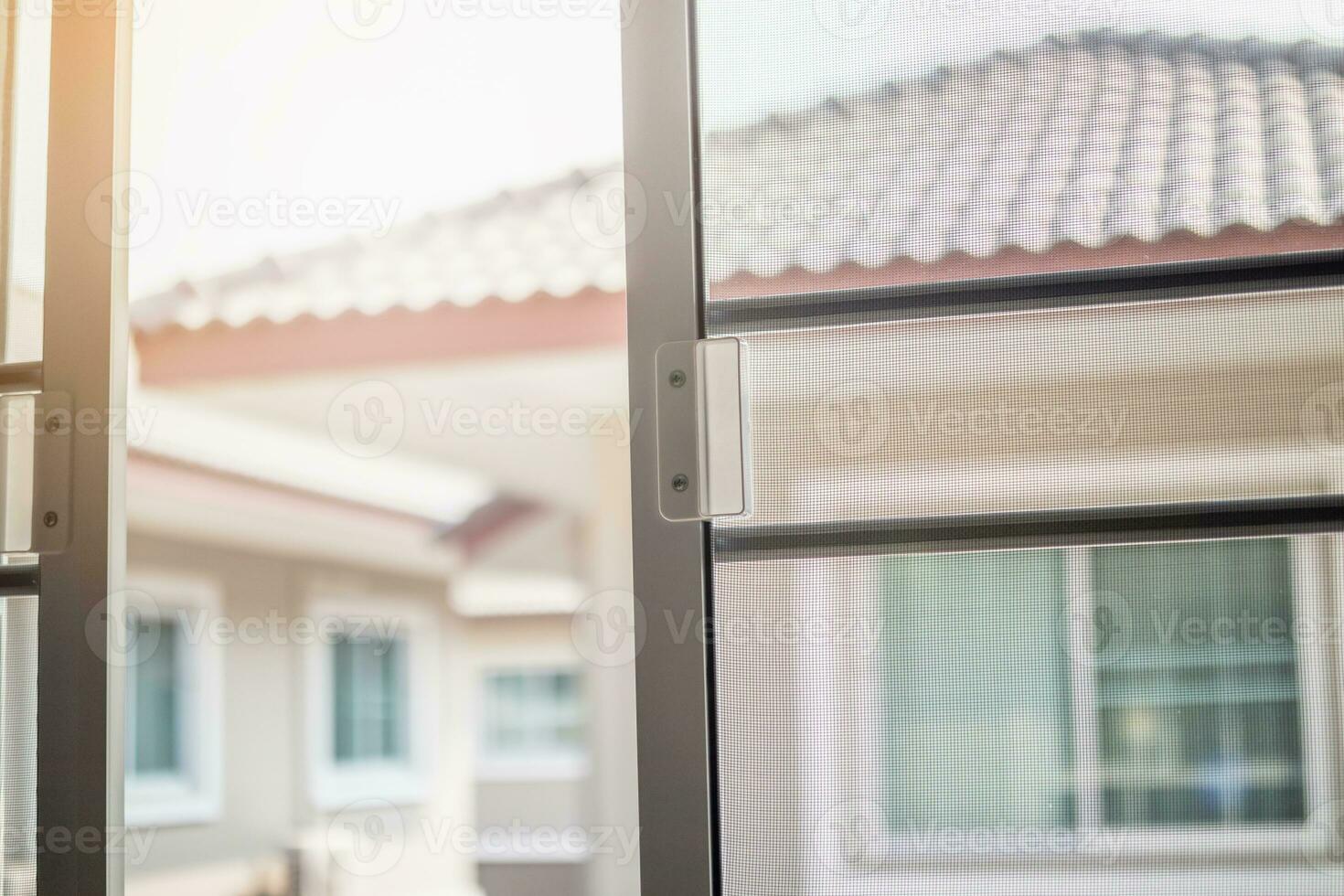 mosquito net wire screen on house window protection against insect photo