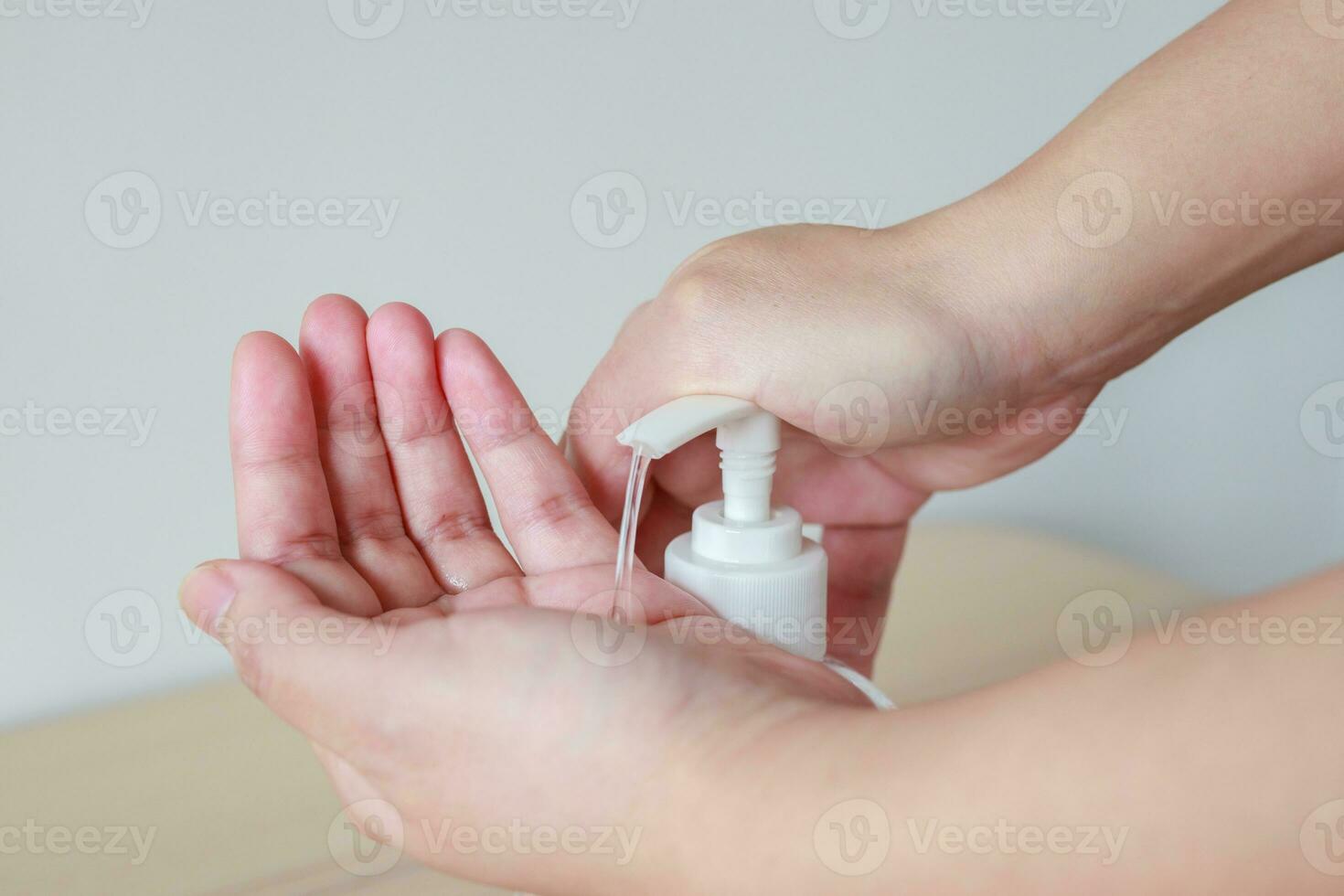 Woman using alcohol sanitizer gel rub for cleaning hand COVID-19 corona virus prevention concept photo