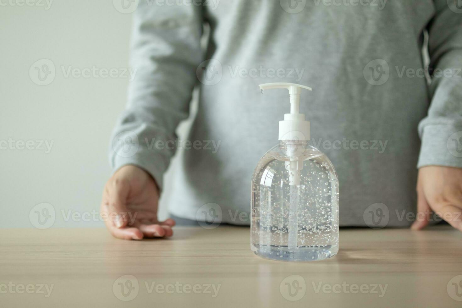 Woman using alcohol sanitizer gel rub for cleaning hand COVID-19 corona virus prevention concept photo