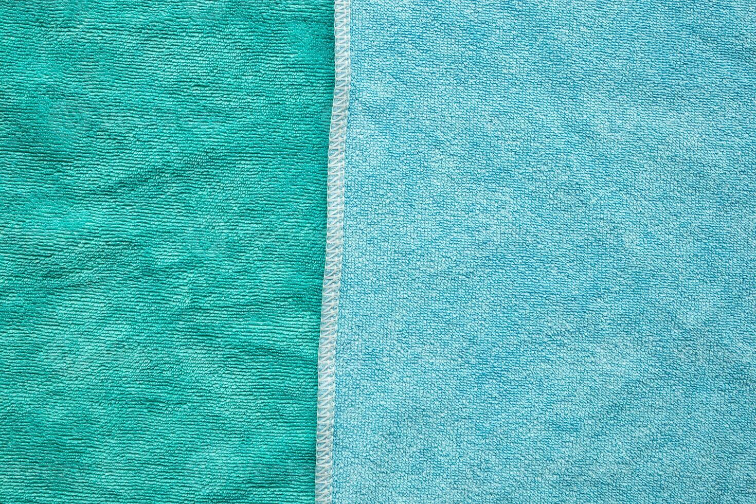 Green and blue towel fabric texture surface close up background photo