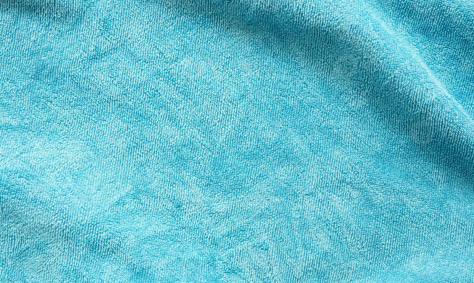 Blue towel fabric texture surface close up background photo