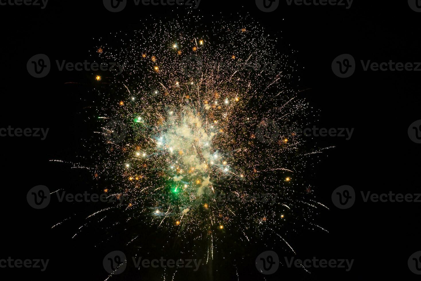 Bright and colorful fireworks at a black night sky photo