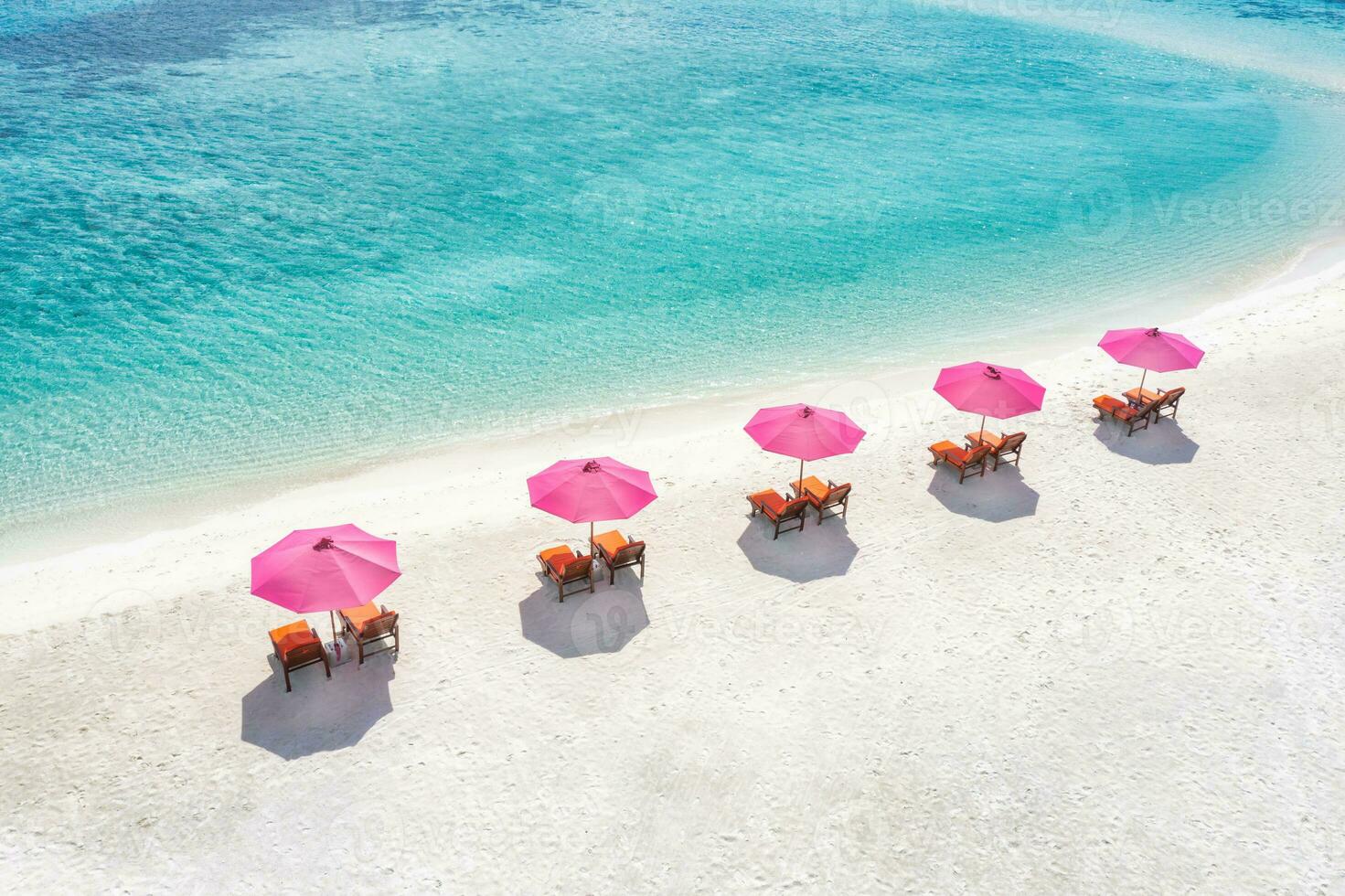 Amazing tranquil sea sand sky. Recreational summer travel tourism. Aerial landscape view with chairs and umbrellas on paradise island beach, seaside. Resort vacation, exotic nature. Beautiful tropics photo