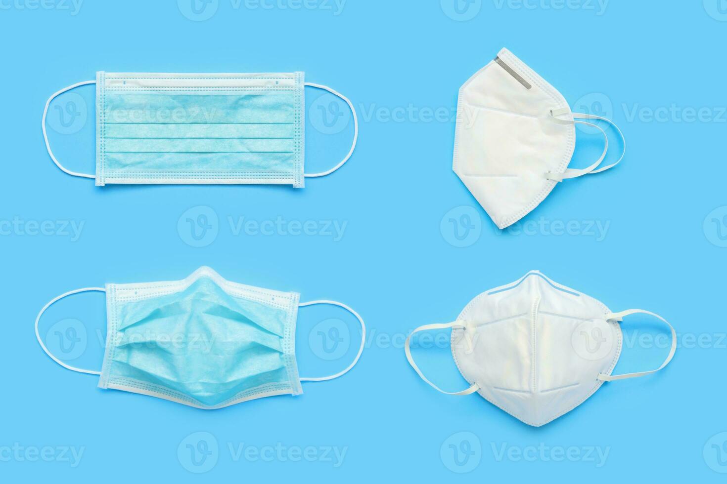 KN95 and surgical face mask on blue background protection against pm 2.5 polution and COVID-19 coronavirus. Healthcare and medical concept photo