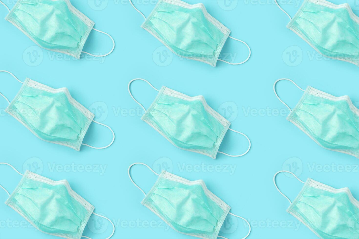 Surgical face mask on blue background protection against COVID-19 coronavirus. Healthcare and medical concept photo