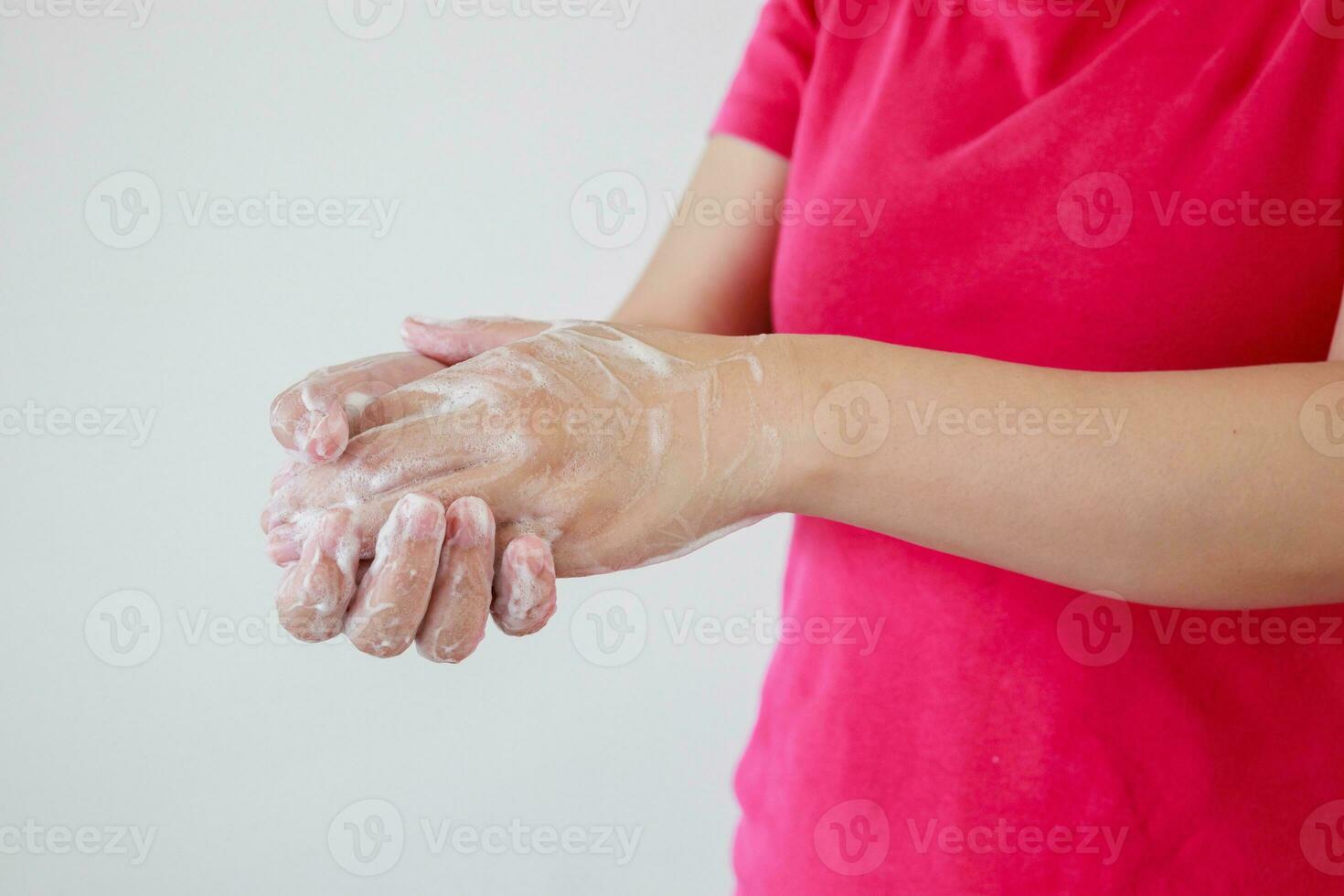 Woman washing hands with soap for COVID-19 corona virus prevention concept photo