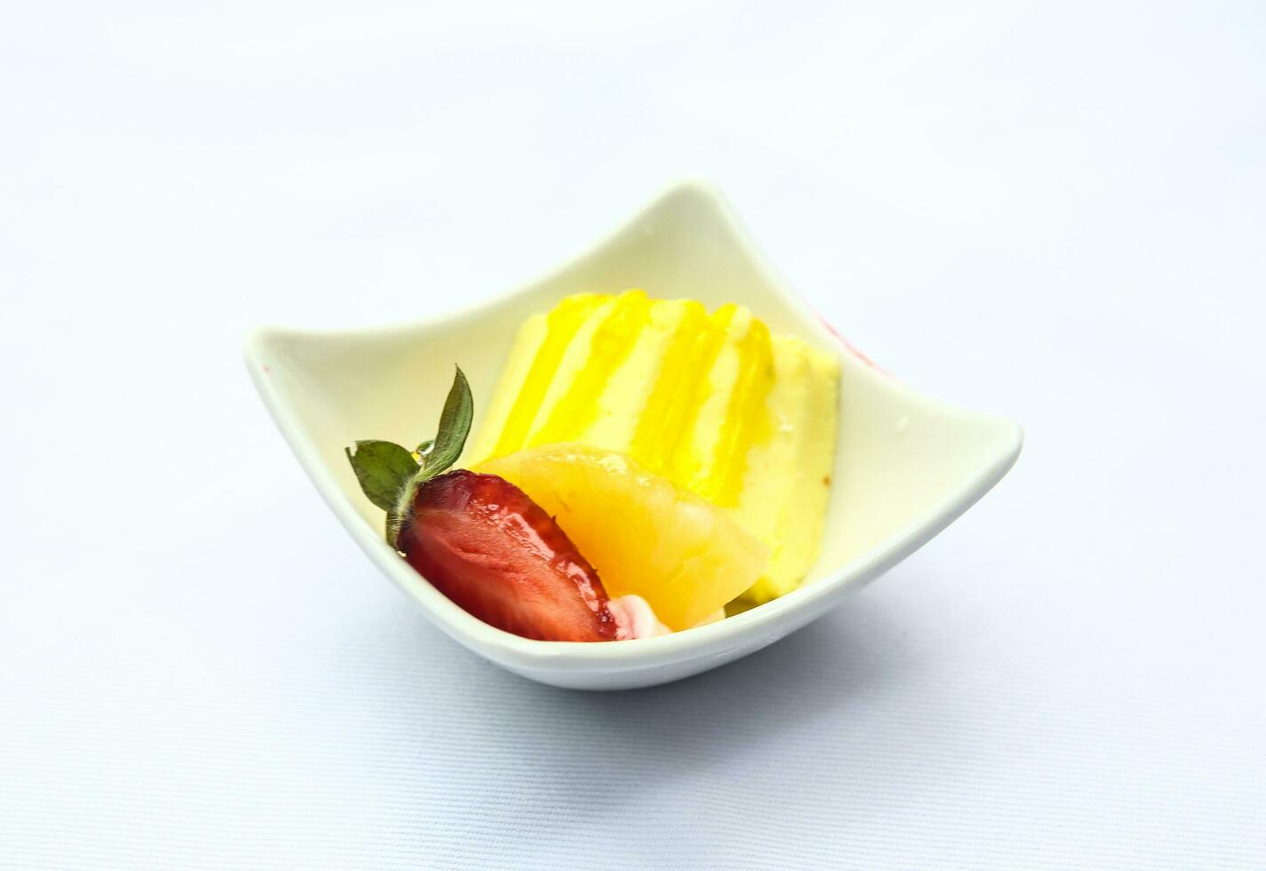 Banana pudding in a bowl on white background photo