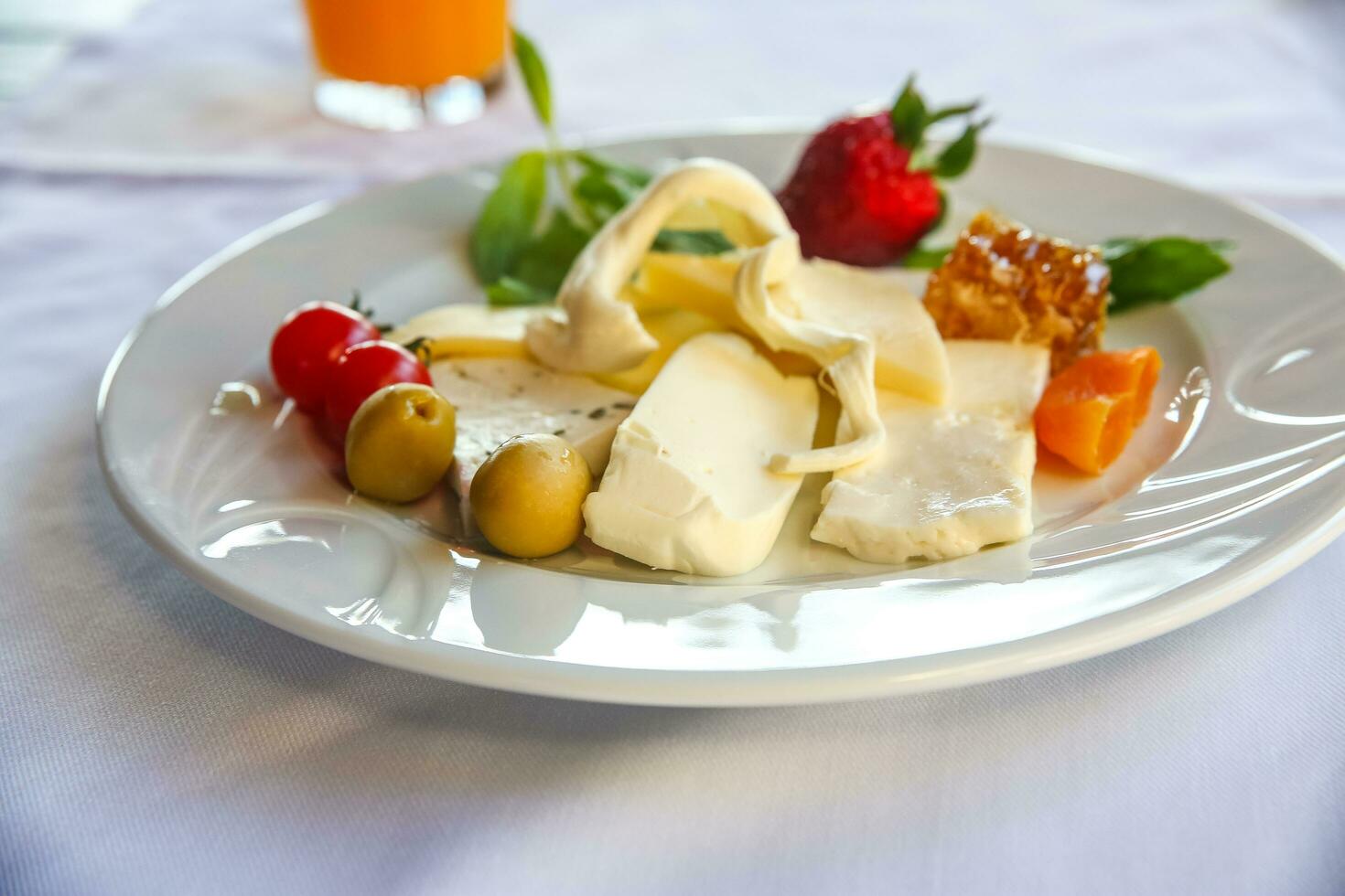 Cheese on the plate and white background photo