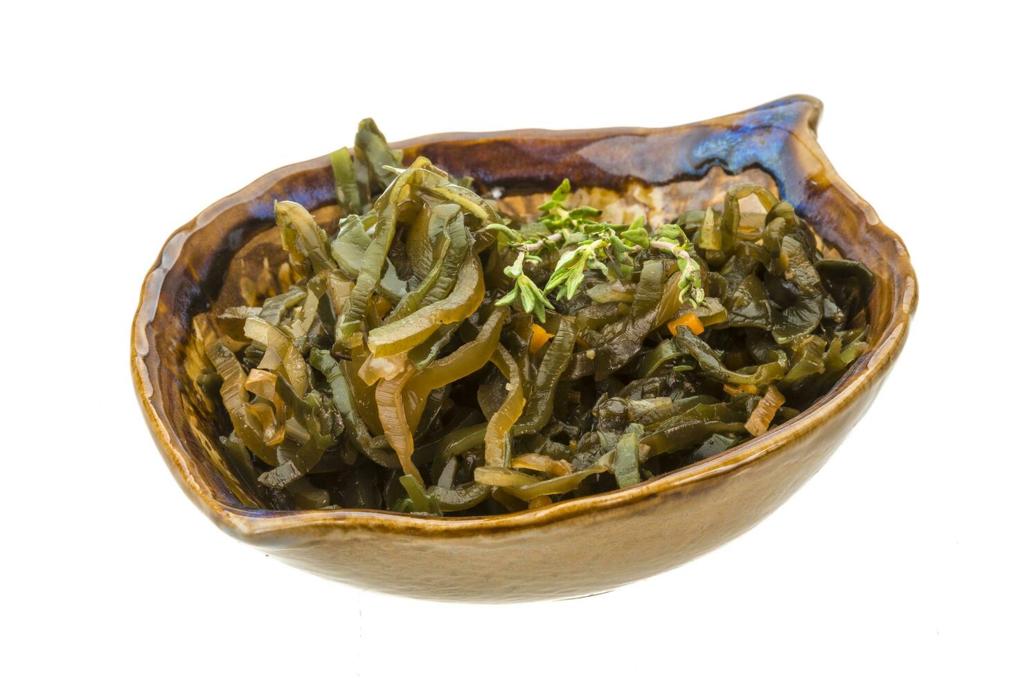 Sea kale in a bowl on white background photo