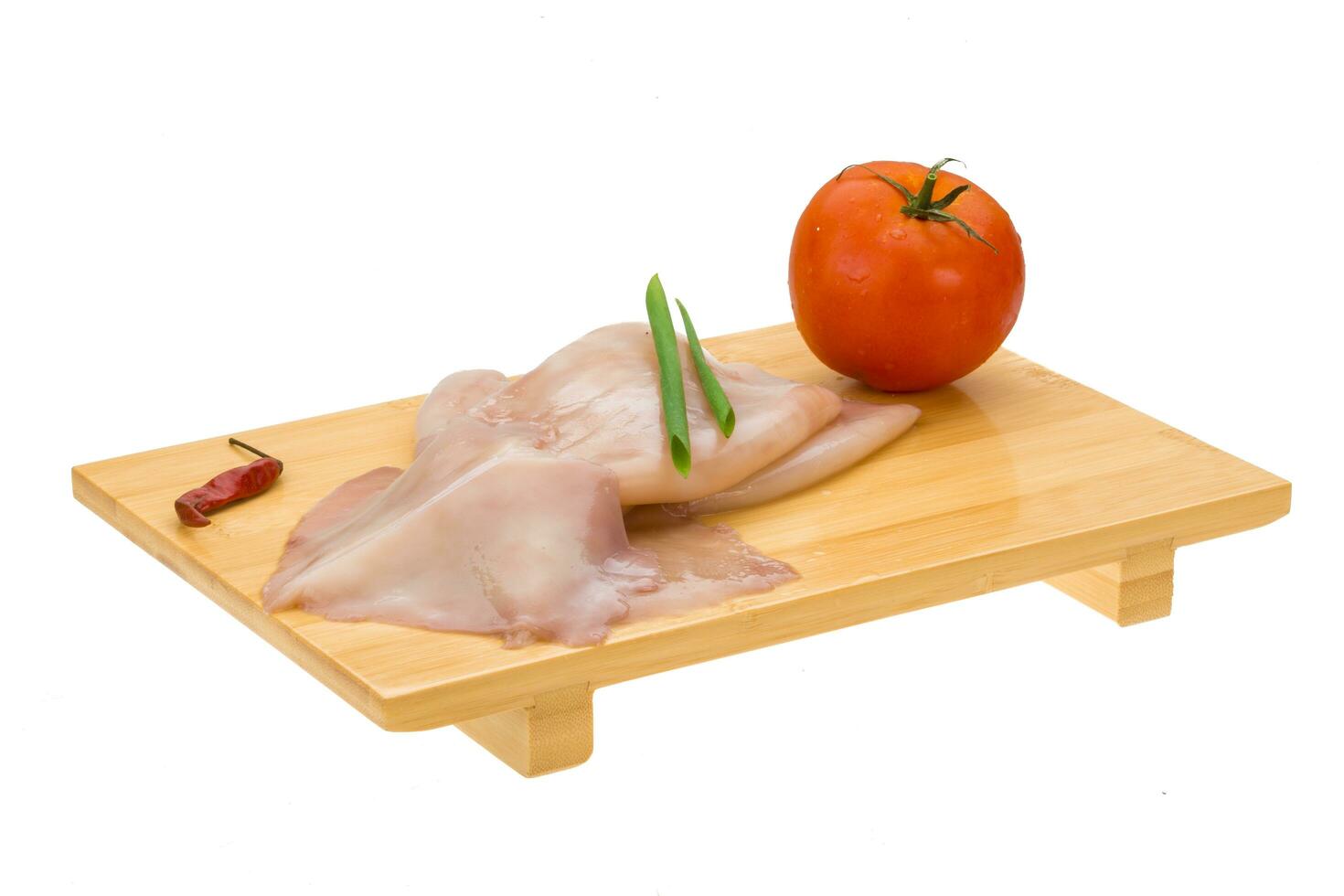 Raw squid on white photo