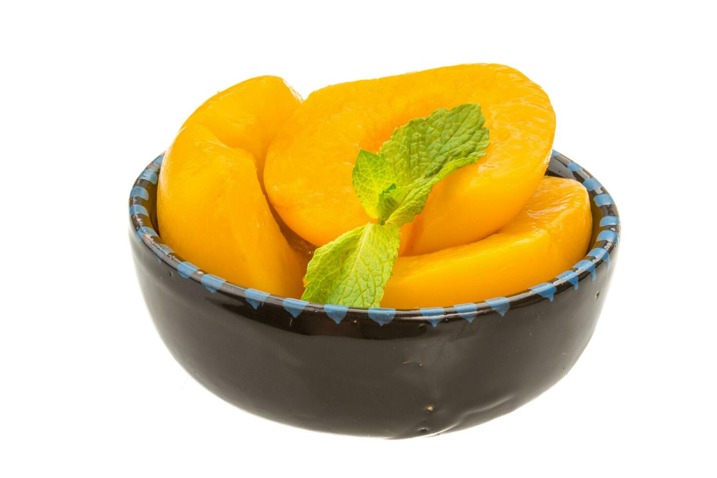 Marinated peaches dish view photo