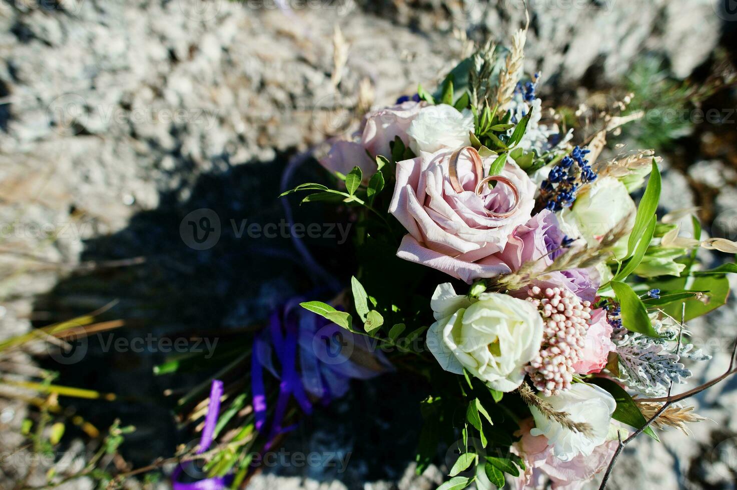 Beautiful tender wedding bouquet and rings. photo