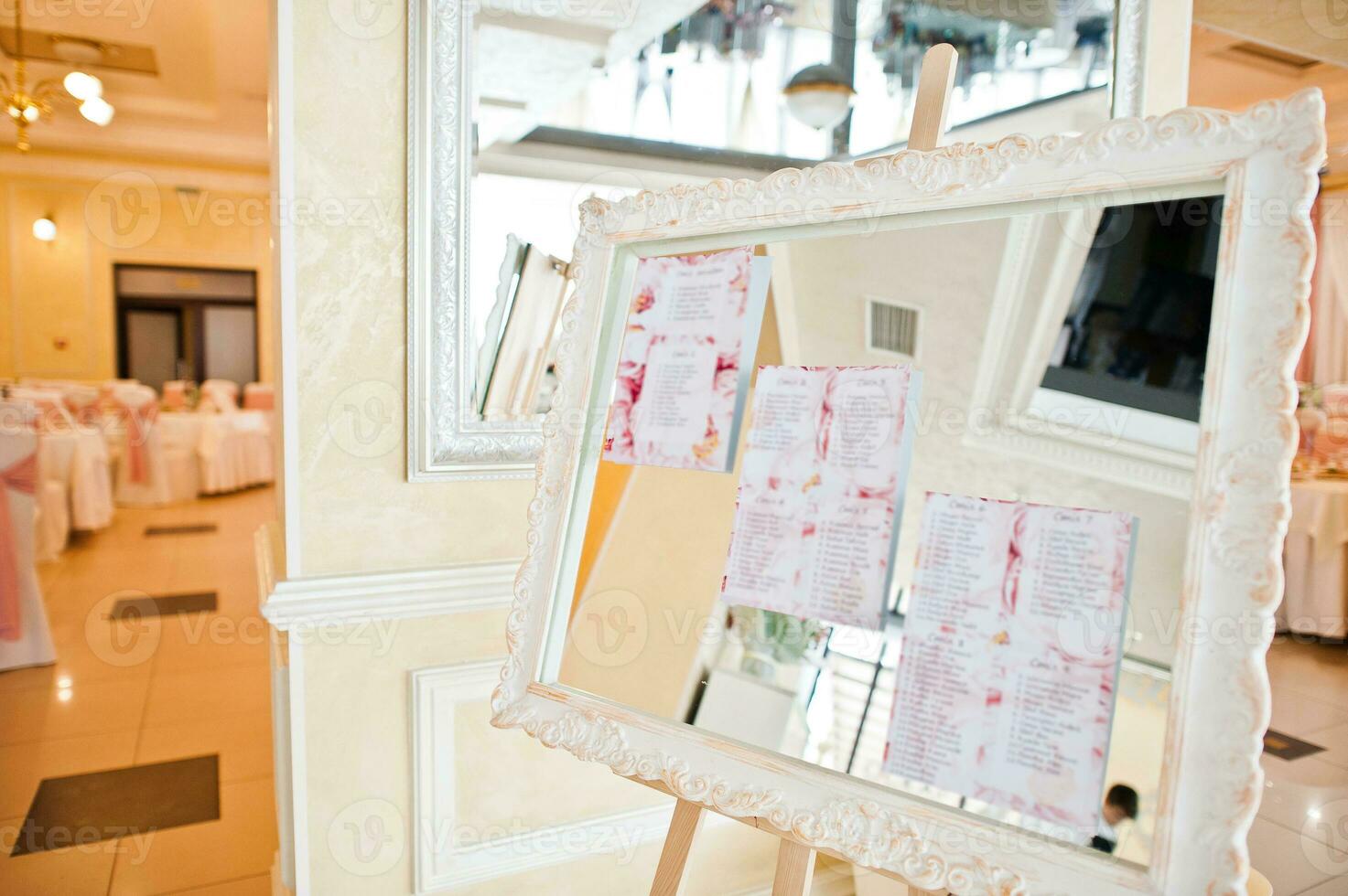 Original mirror board with decoration and a guest wedding list. photo