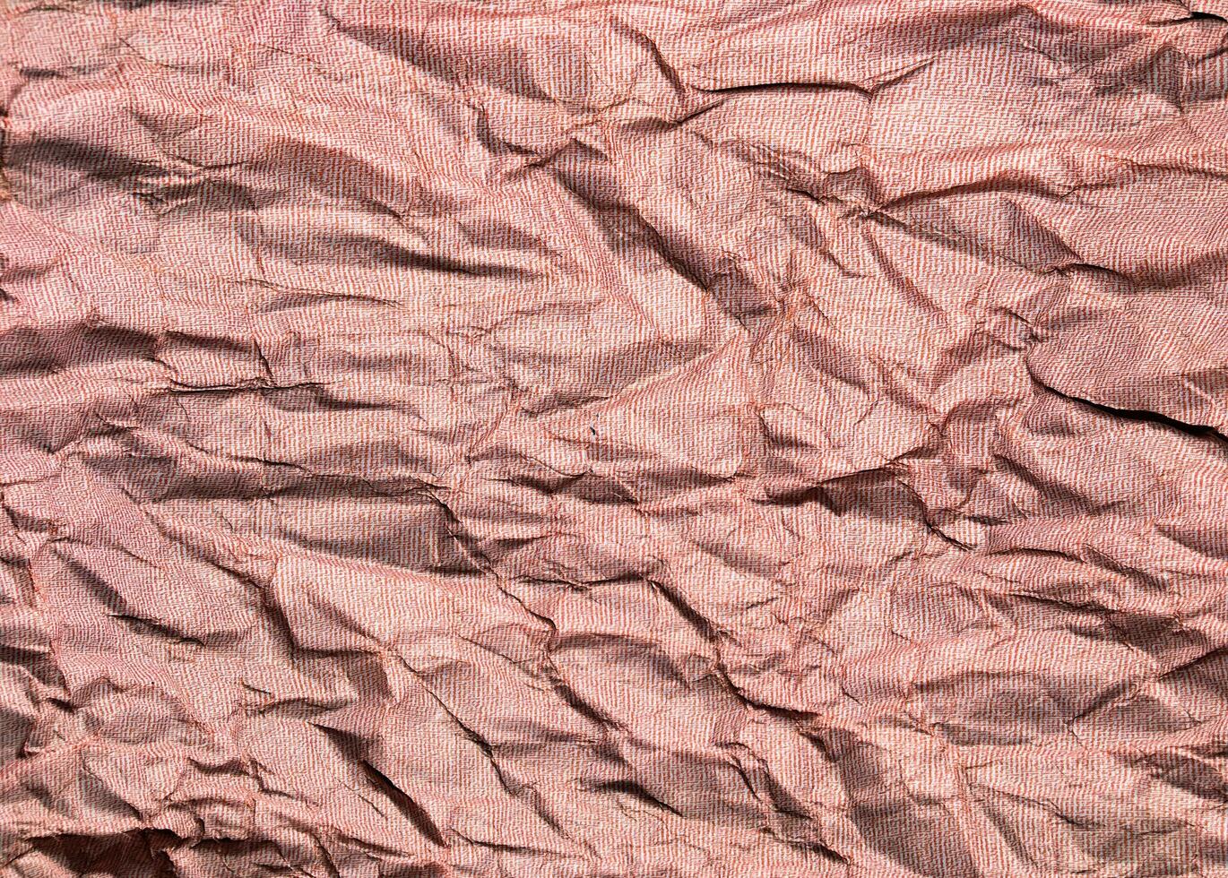 Beautiful pattern of red crumpled paper texture background. photo