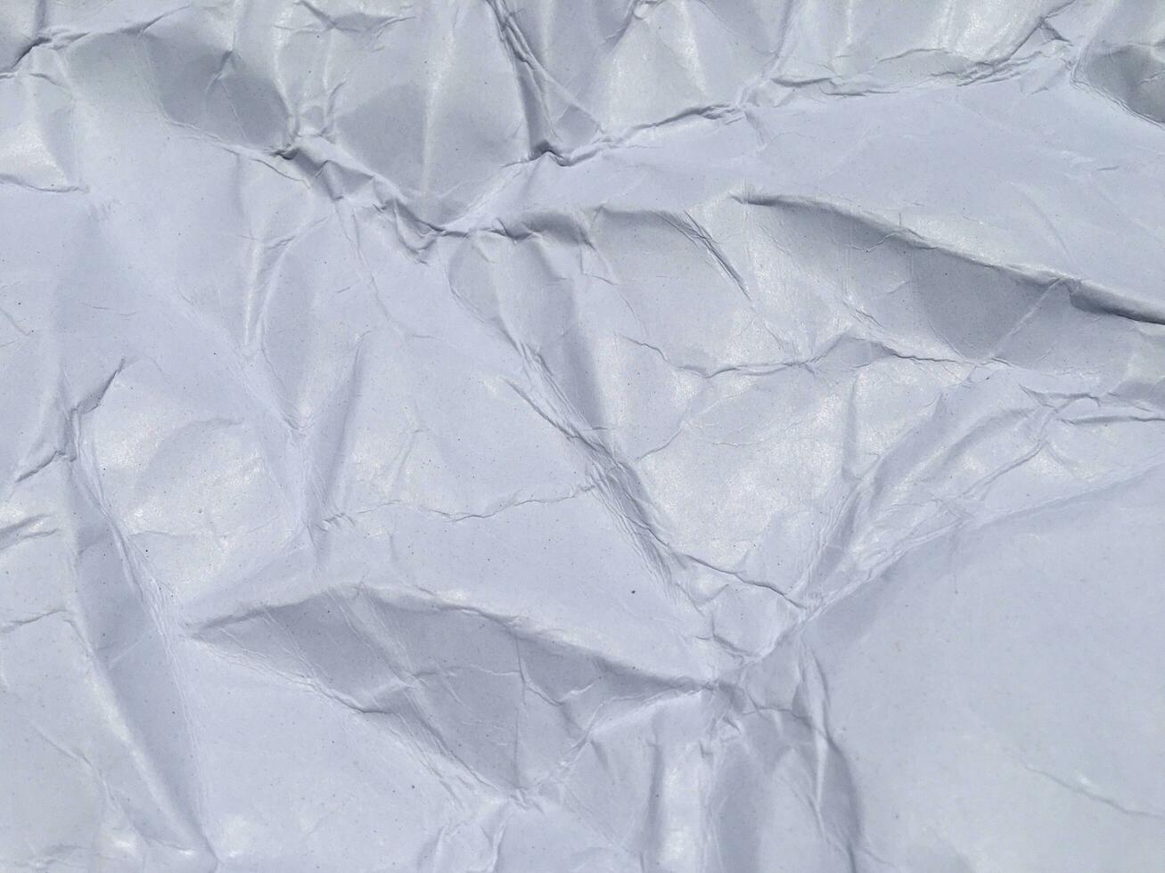 Top view of white crumpled paper texture background. Copy space for design and artwork photo