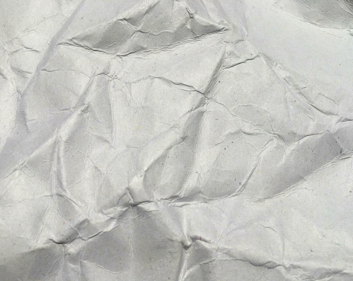 Top view of white crumpled paper texture background. Copy space for design and artwork photo