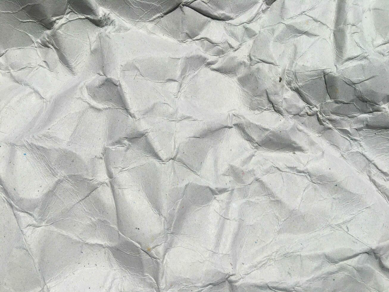 Top view of white crumpled paper texture background. Copy space for design and artwork photo