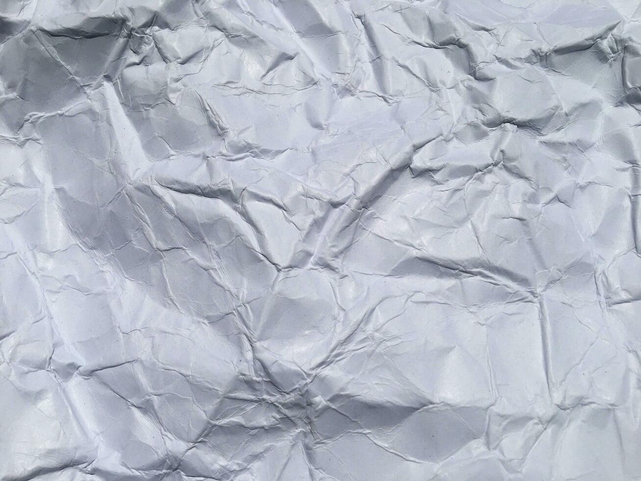 Top view of white crumpled paper texture background. Copy space for design and artwork photo