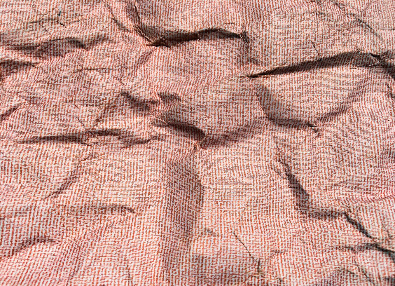 Beautiful pattern of red crumpled paper texture background. photo