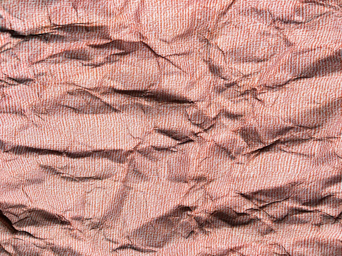 Beautiful pattern of red crumpled paper texture background. photo