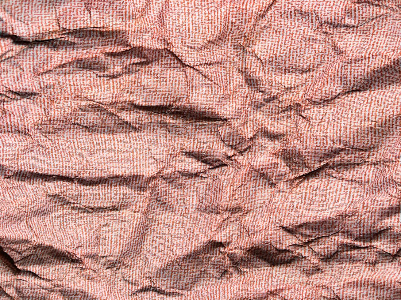 Beautiful pattern of red crumpled paper texture background. photo