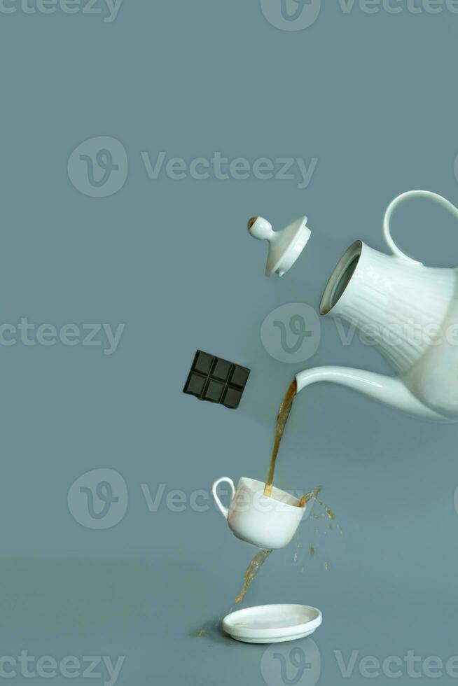 A close up photography of a tea using a teapot and cup. Tea time