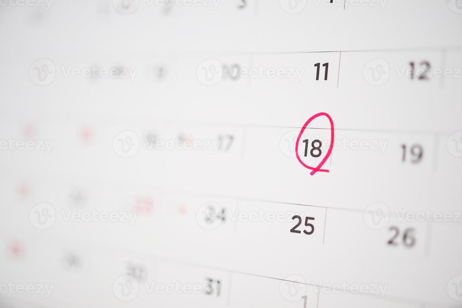 Red circle mark at 18th on calendar date business planning appointment meeting concept photo