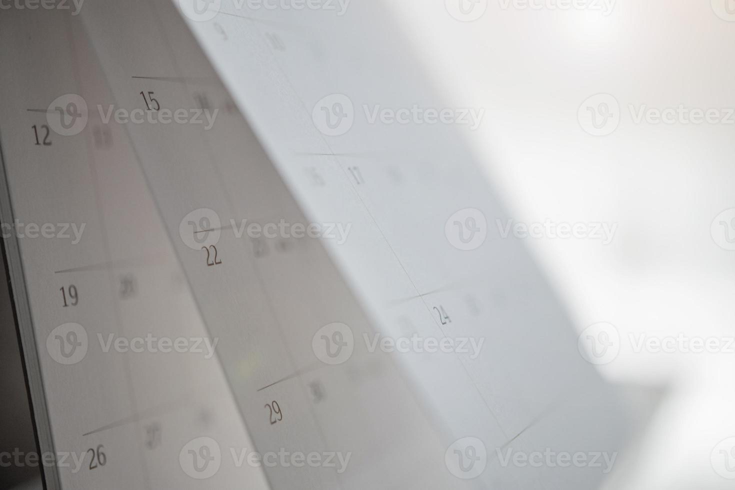 calendar page flipping sheet close up on wood table background business planning appointment meeting concept photo