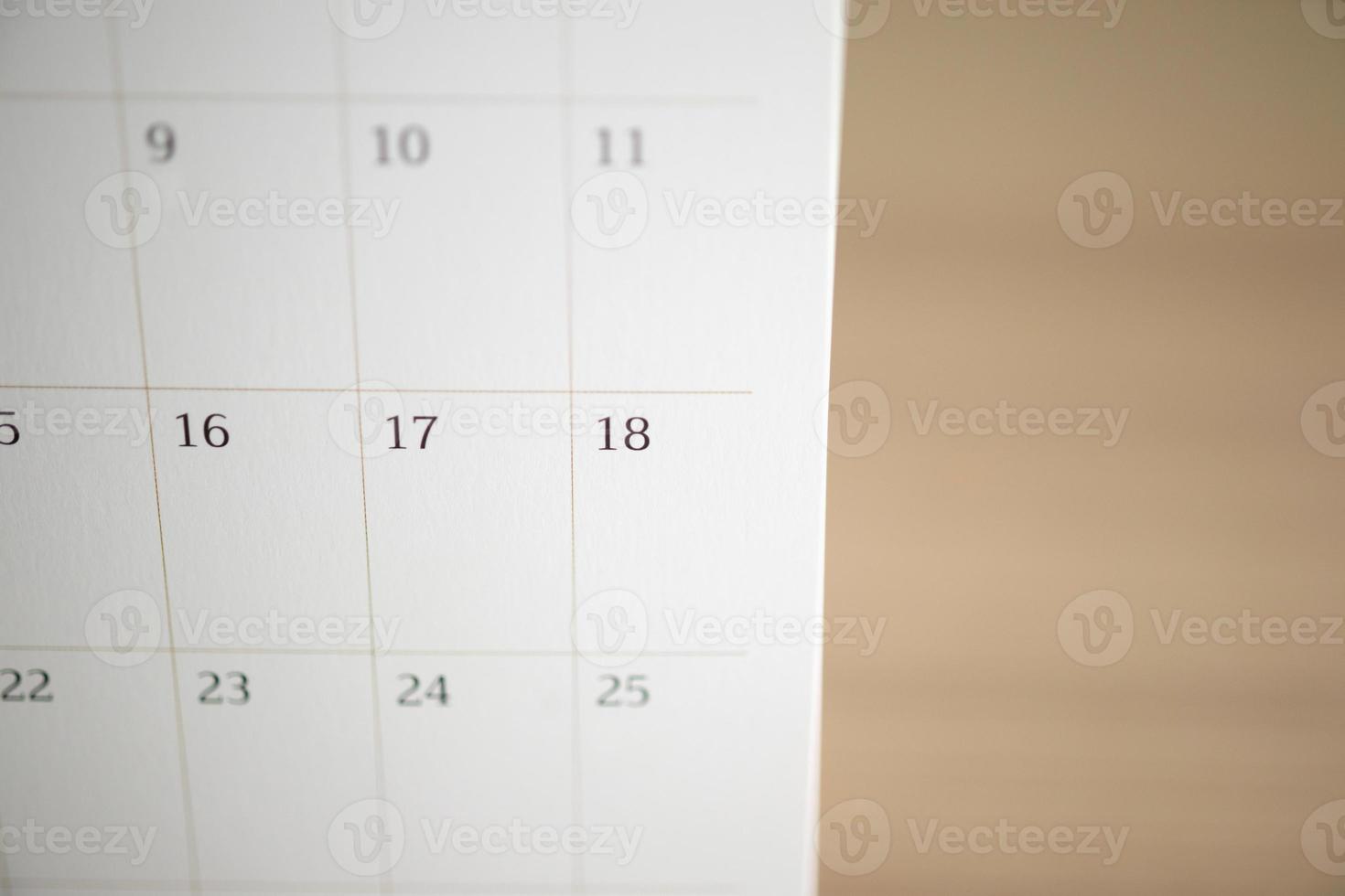 calendar page close up on wood table background business planning appointment meeting concept photo