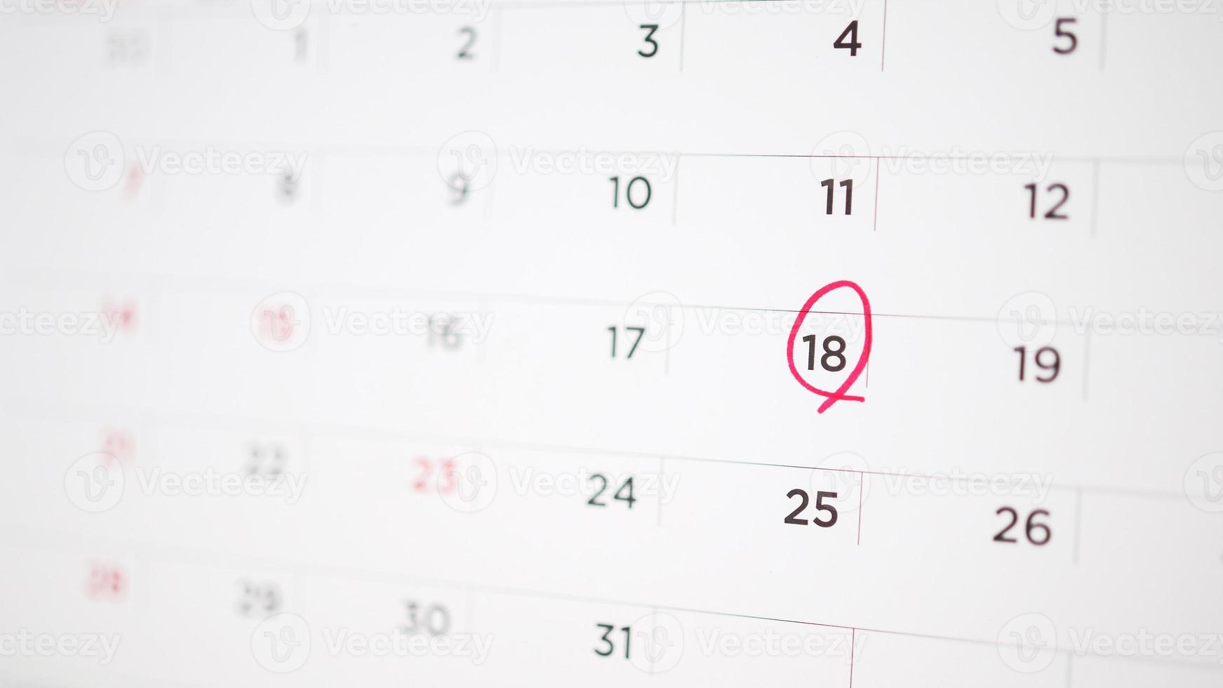 Red circle mark at 18th on calendar date business planning appointment meeting concept photo