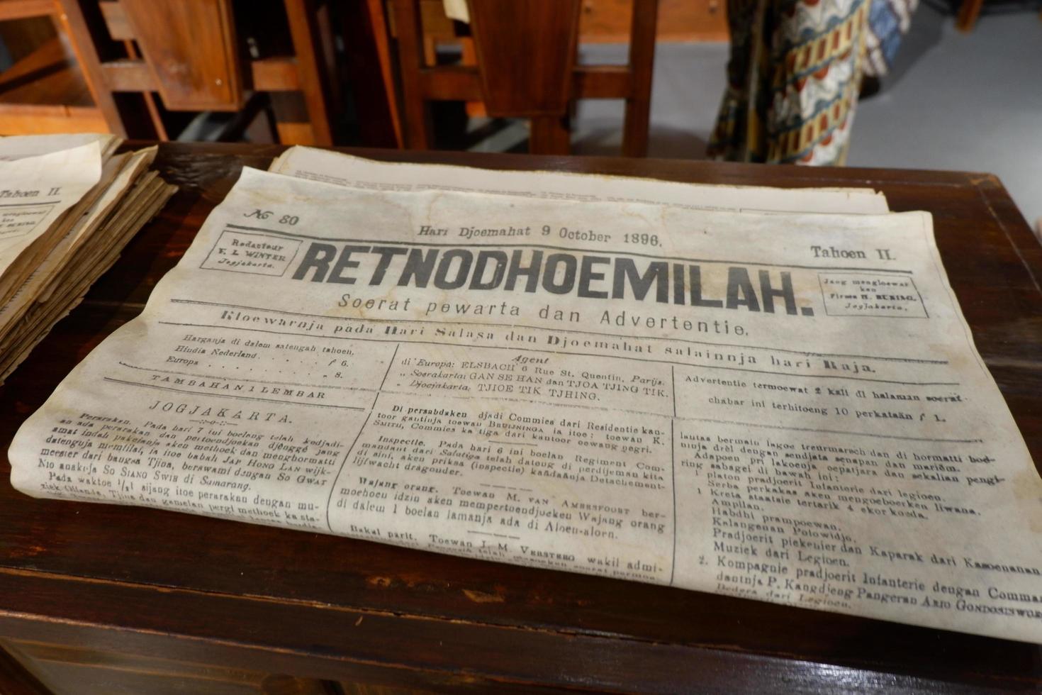 Jakarta, Indonesia - May 21, 2022, The old newspaper lying on a table photo