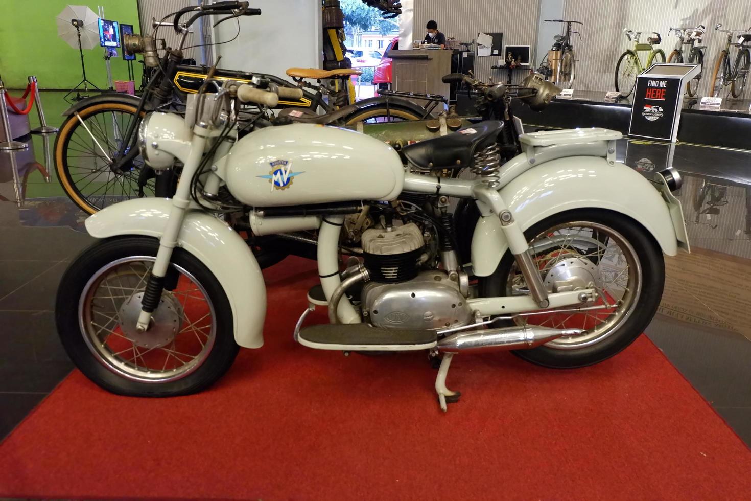 Batu, East Java, Indonesia - August  10, 2022 ,Antique white motorcycle in Angkut museum photo