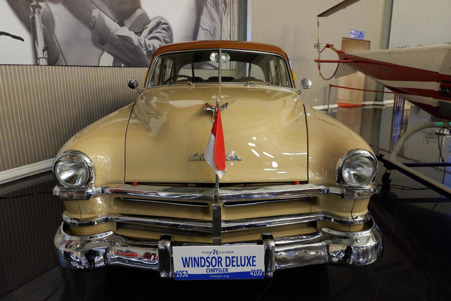 Batu, East Java, Indonesia - August  10, 2022, Windsor Deluxe, Chrysler, Thn 1952, 4100cc,   Antique Yellow Car in Angkut museum photo