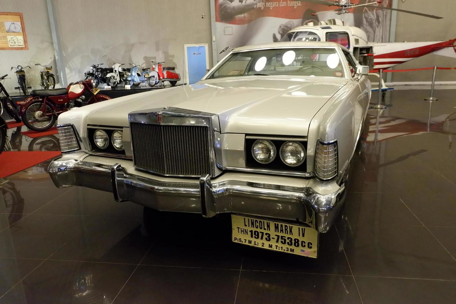 Batu, East Java, Indonesia - August  10, 2022, Lincoln Mark IV, Thn 1973-7538cc, Antique silver car in Angkut museum photo