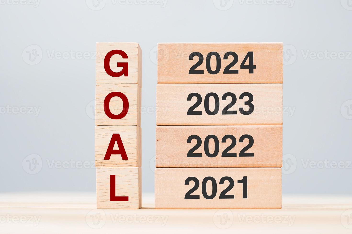 2024 block over 2023 and 2022 wooden building on table background. Business planning, Risk Management, Resolution, strategy, solution, goal, New Year New You and happy holiday concepts photo