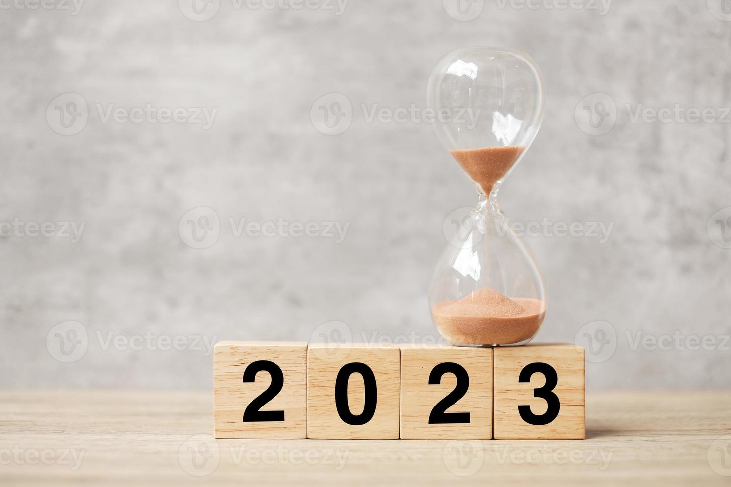 2023 text with hourglass on table. Resolution, time, plan, goal, motivation, reboot, countdown  and New Year holiday concepts photo