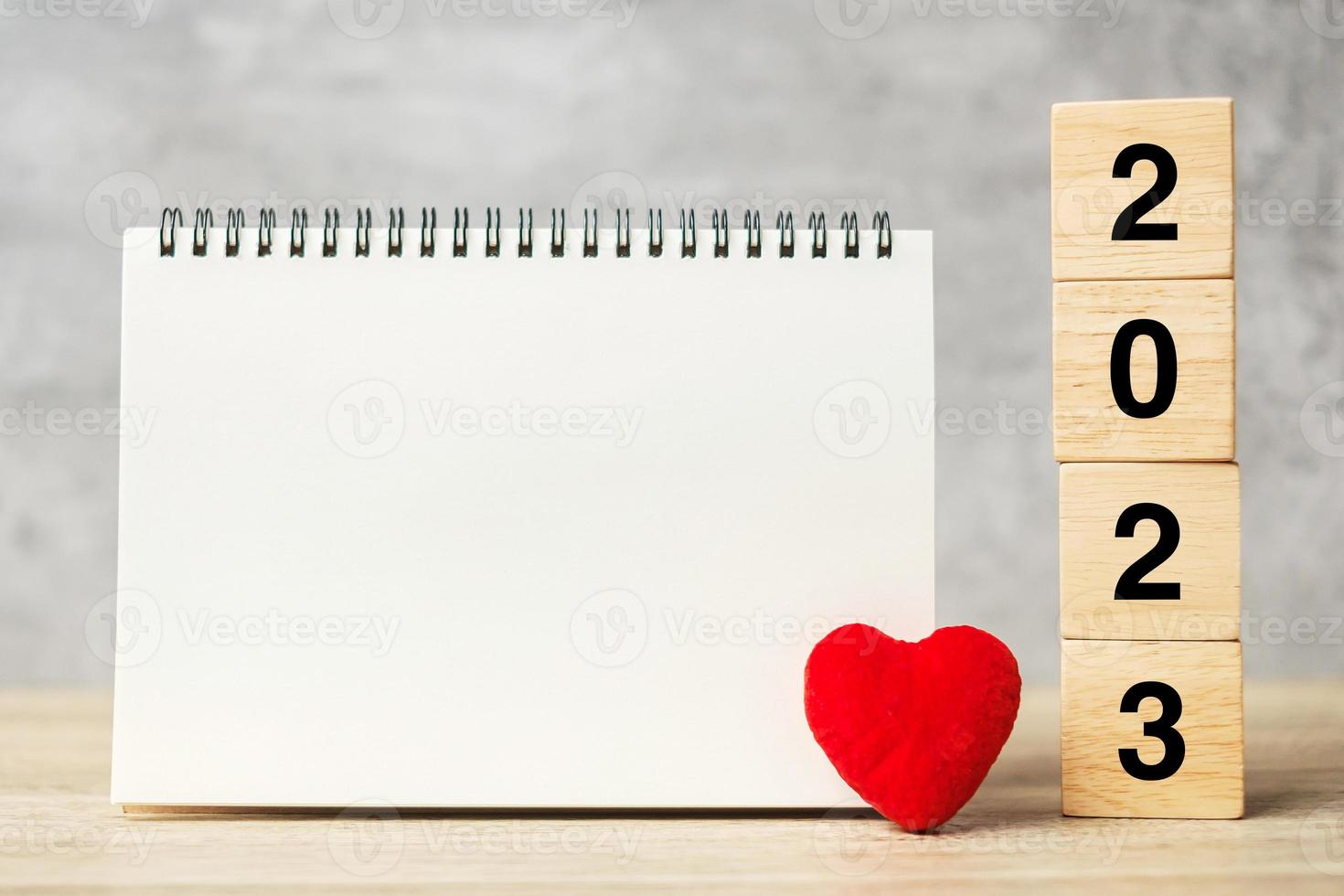 2023 cubes with red heart shape and empty notebook on table for your text. New Year, Resolution, Goal, plan, health, Love and Happy Valentine day concept photo