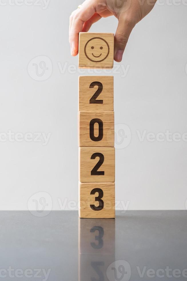 Smile face block with 2023 text.  Satisfaction, feedback, Review and New Year concepts photo