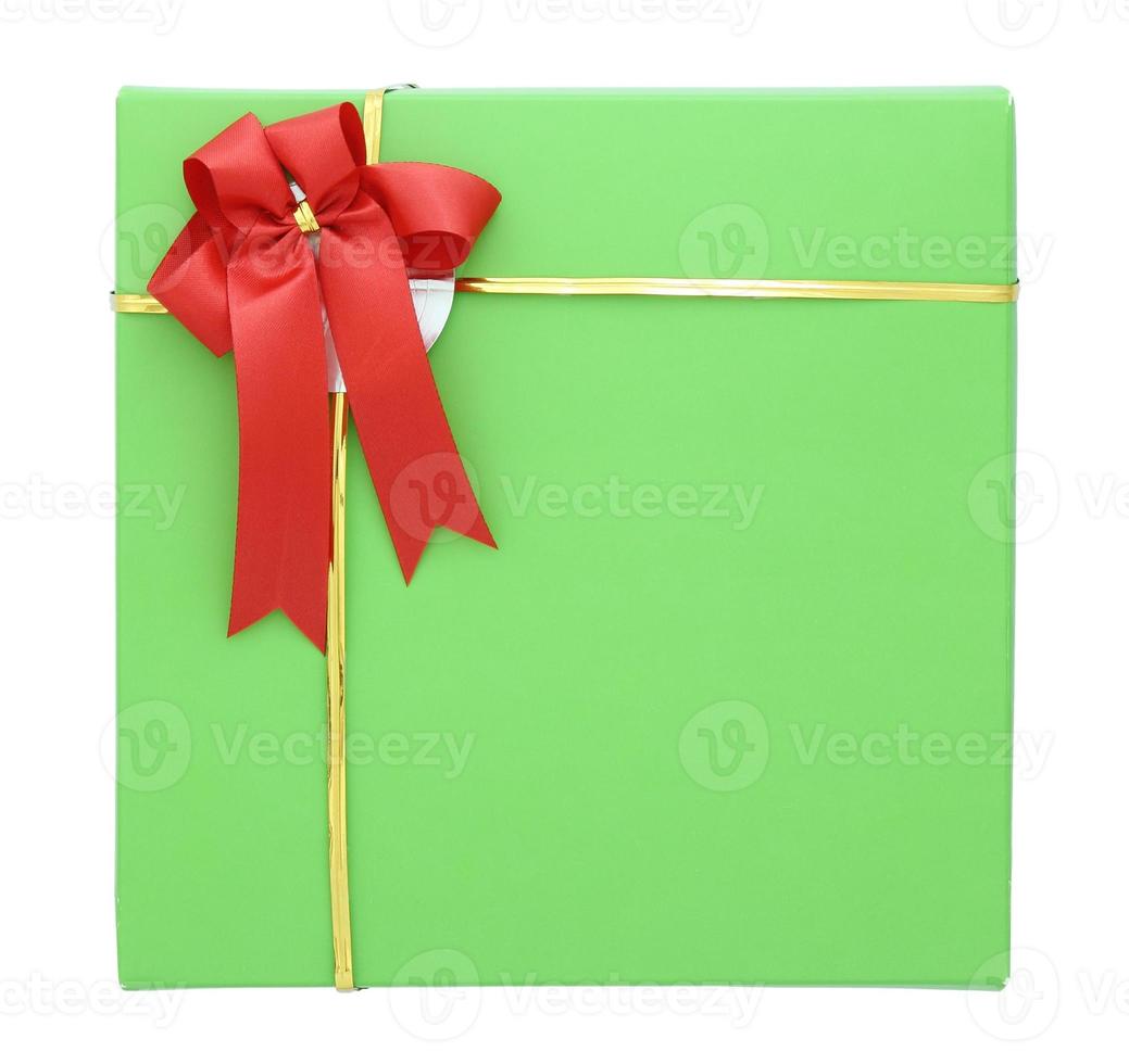 Green gift box with red ribbon bow isolated on white with clipping path photo