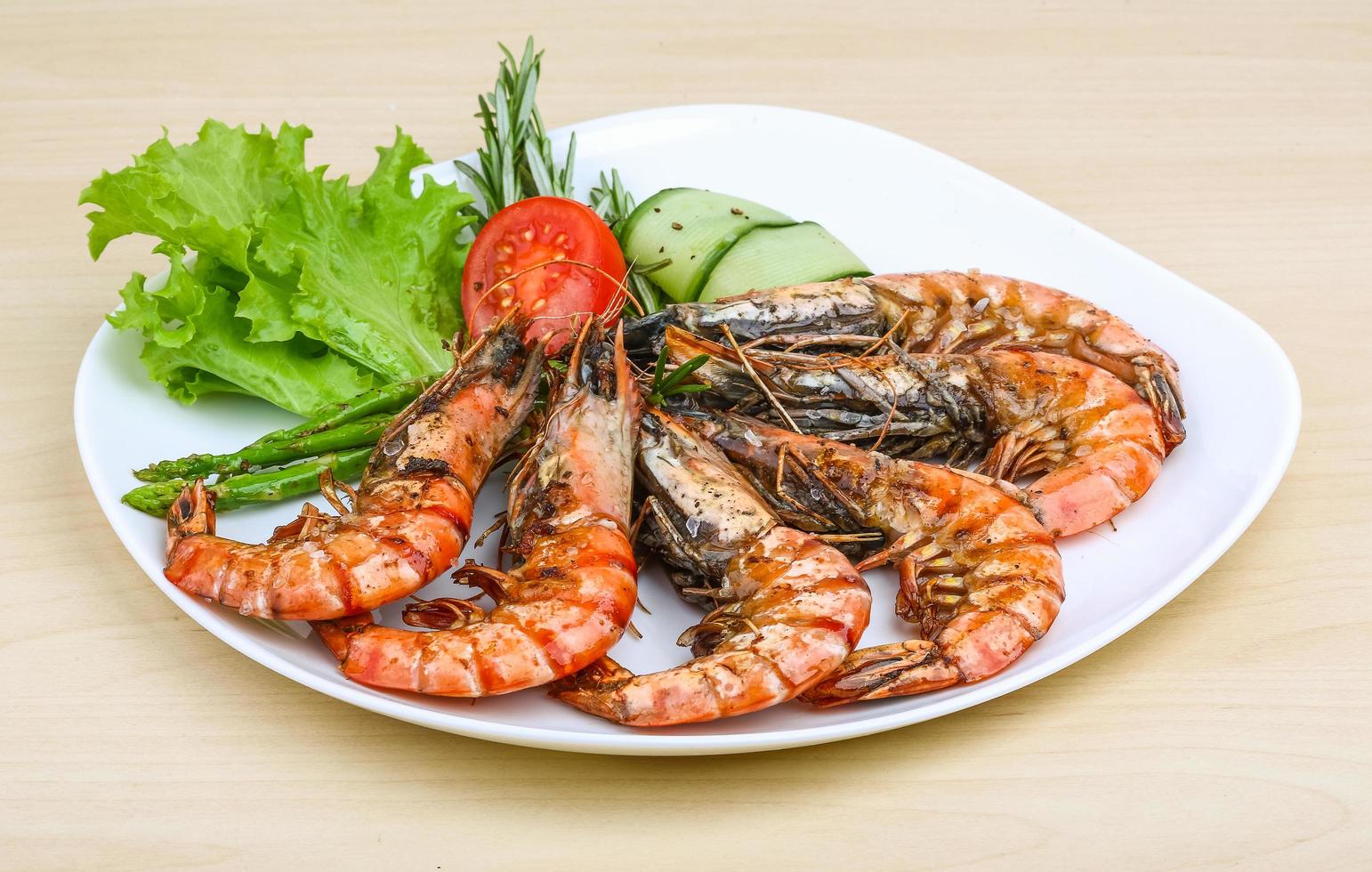 Grilled prawns on the plate and white background photo