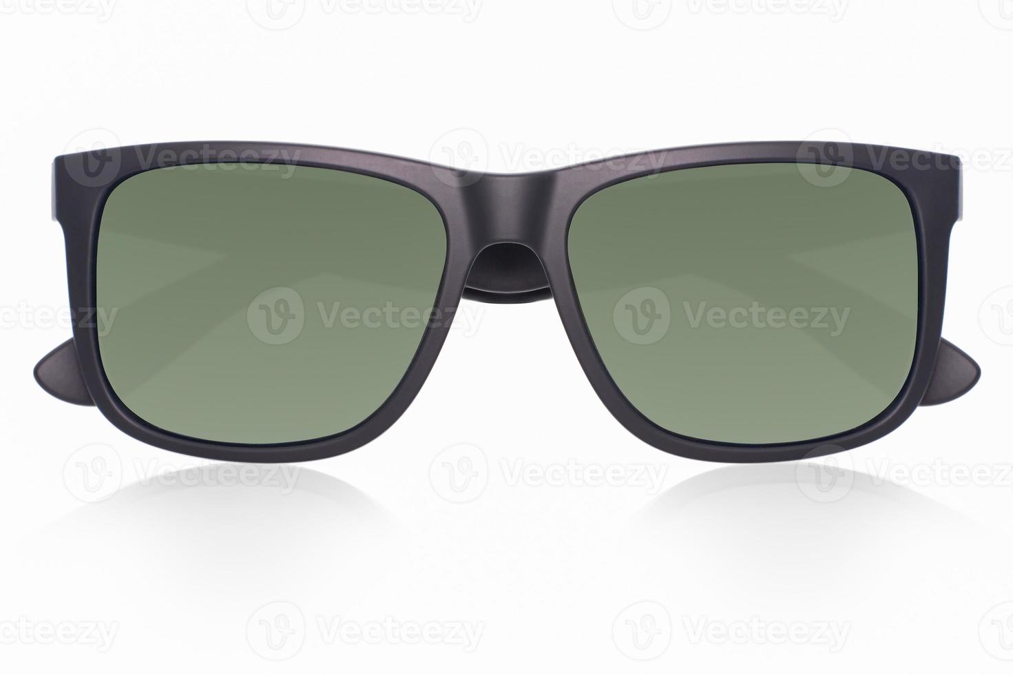 Plastic frame black matt sunglasses with green polarised lenses on white background with shadow reflection from the front view photo