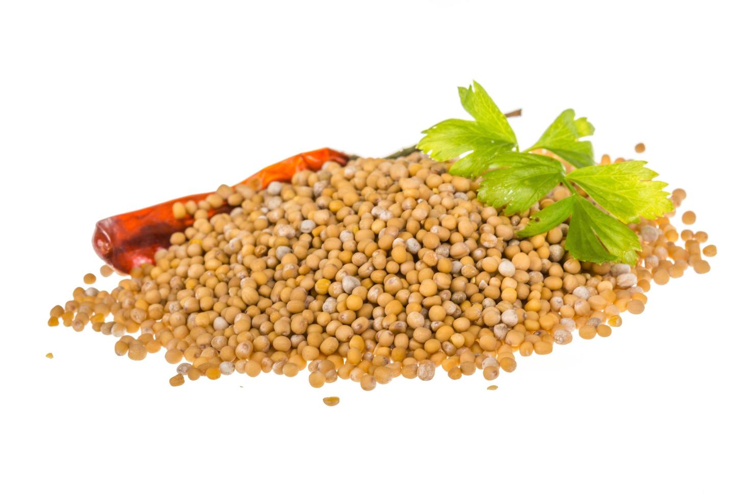 Mustard seeds on white background photo