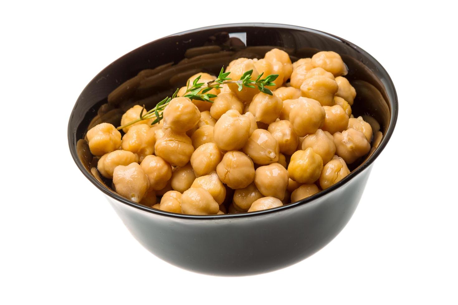 Chickpea in a bowl on white background photo